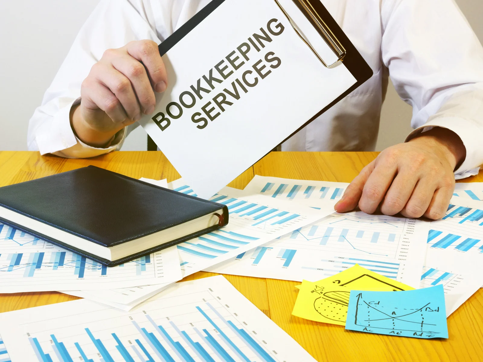 Bookkeeping Services Burnaby written on the notebook